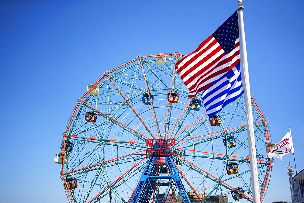 Flags in front of Ferris wheel