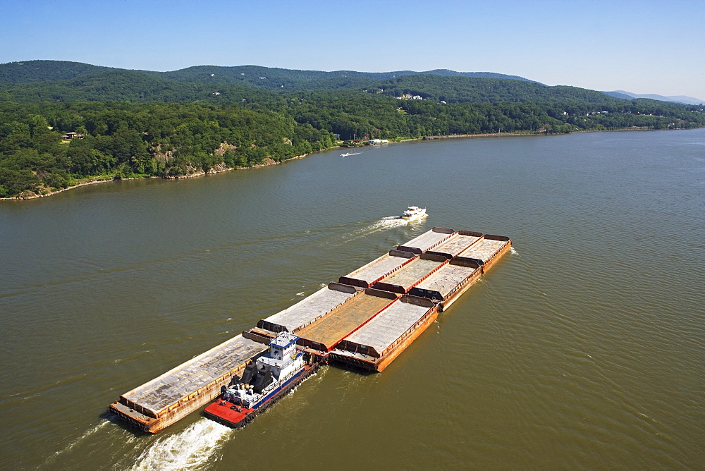 Boat and barges in river