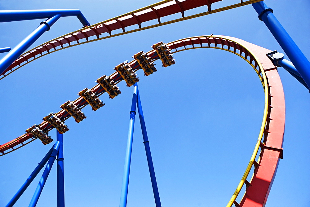 Rollercoaster against blue sky