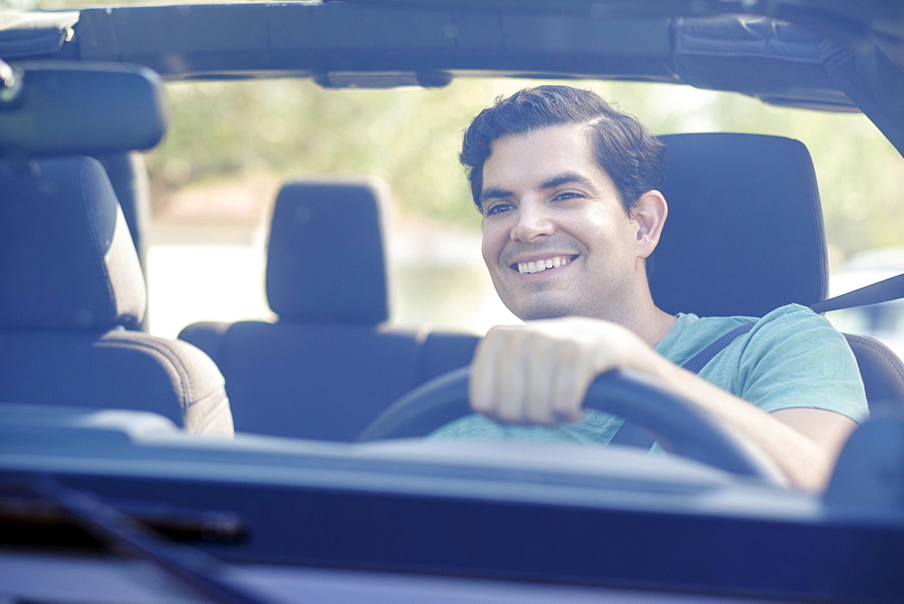 View of man driving car