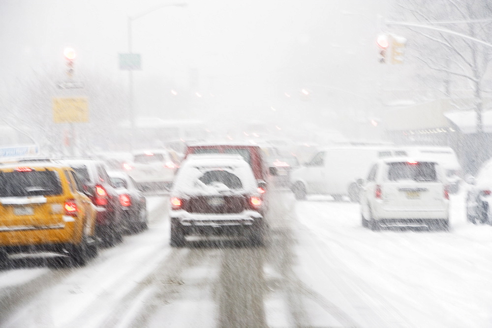 USA, New York City, city traffic in snowstorm