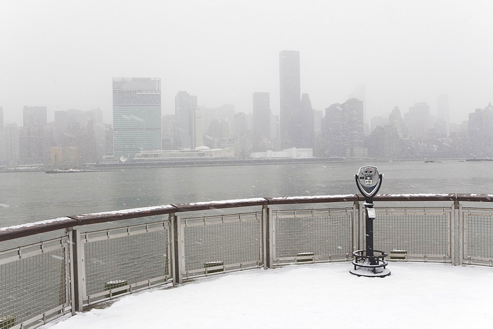 USA, New York City, coin operated binoculars overlooking foggy Manhattan