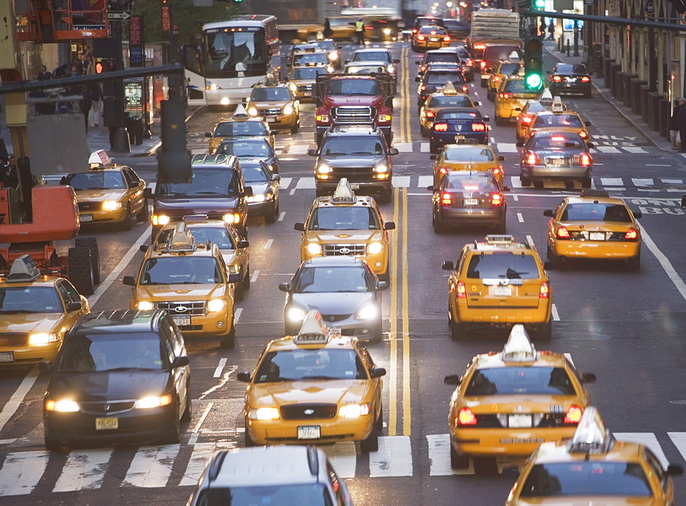 USA, New York City, Manhattan, Traffic stopped at zebra crossing on 42nd street