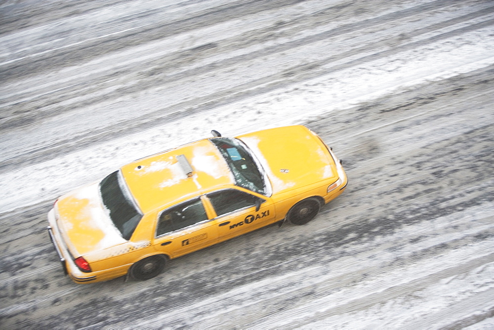 USA, New York State, New York City, blurred motion of yellow taxi