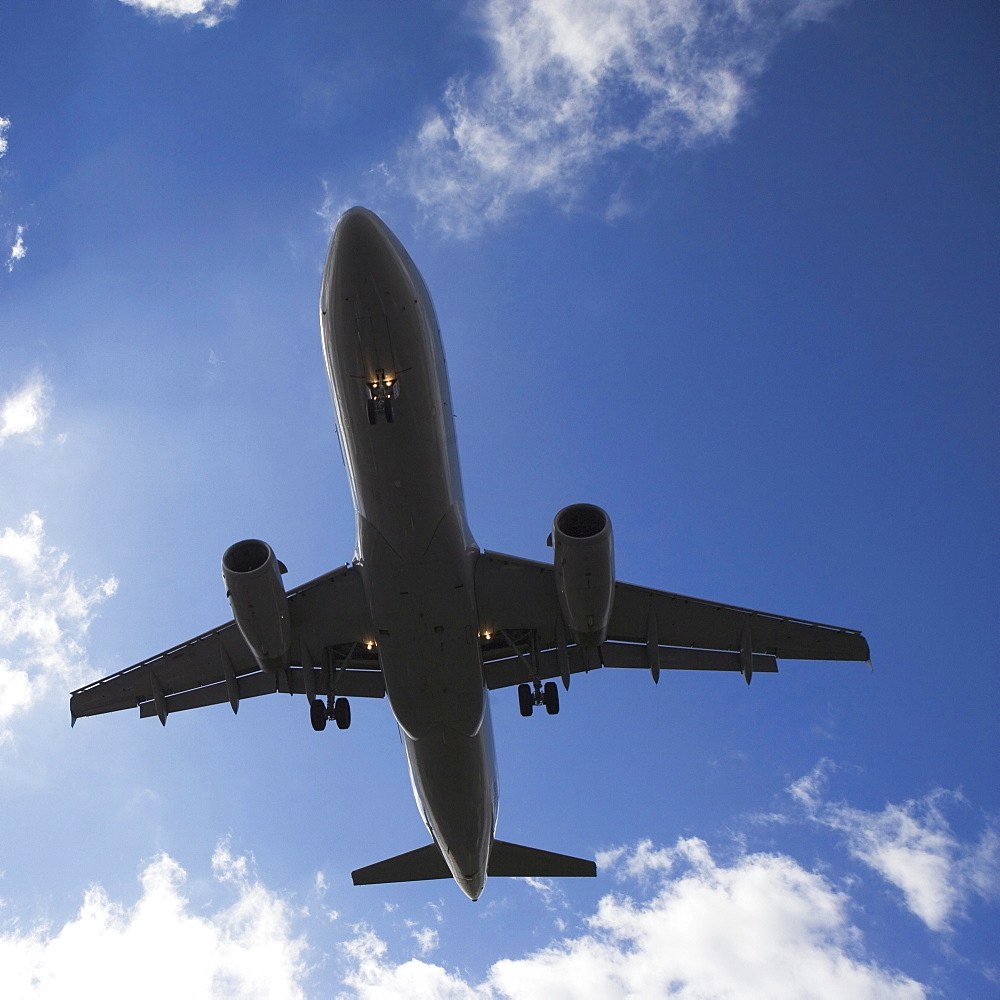Low angle view of flying airplane