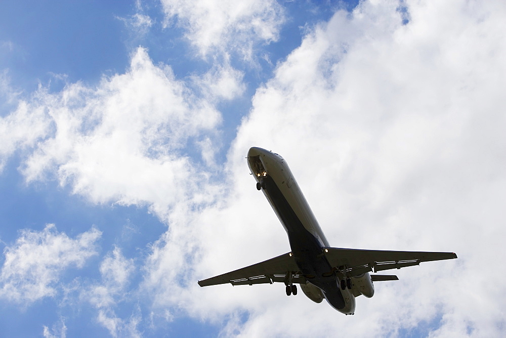 Low angle view of flying airplane