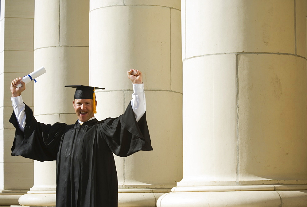 Male graduate cheering