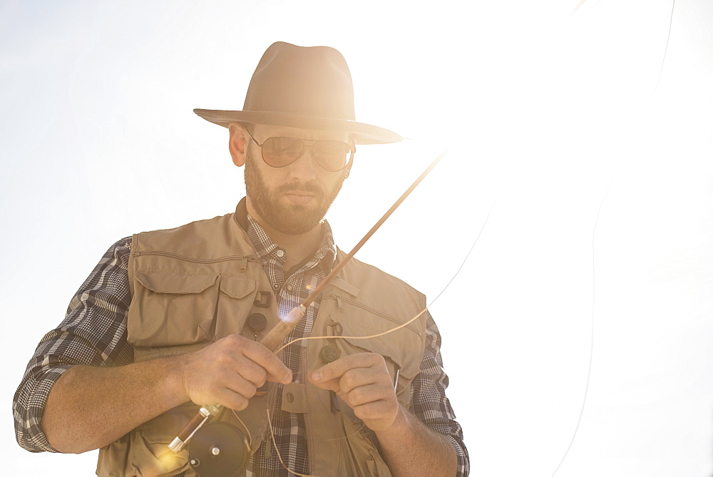 Portrait of man holding fishing rod