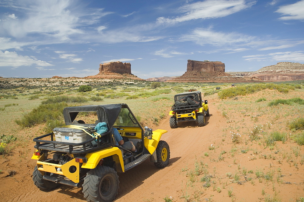 Off-road vehicles driving through desert