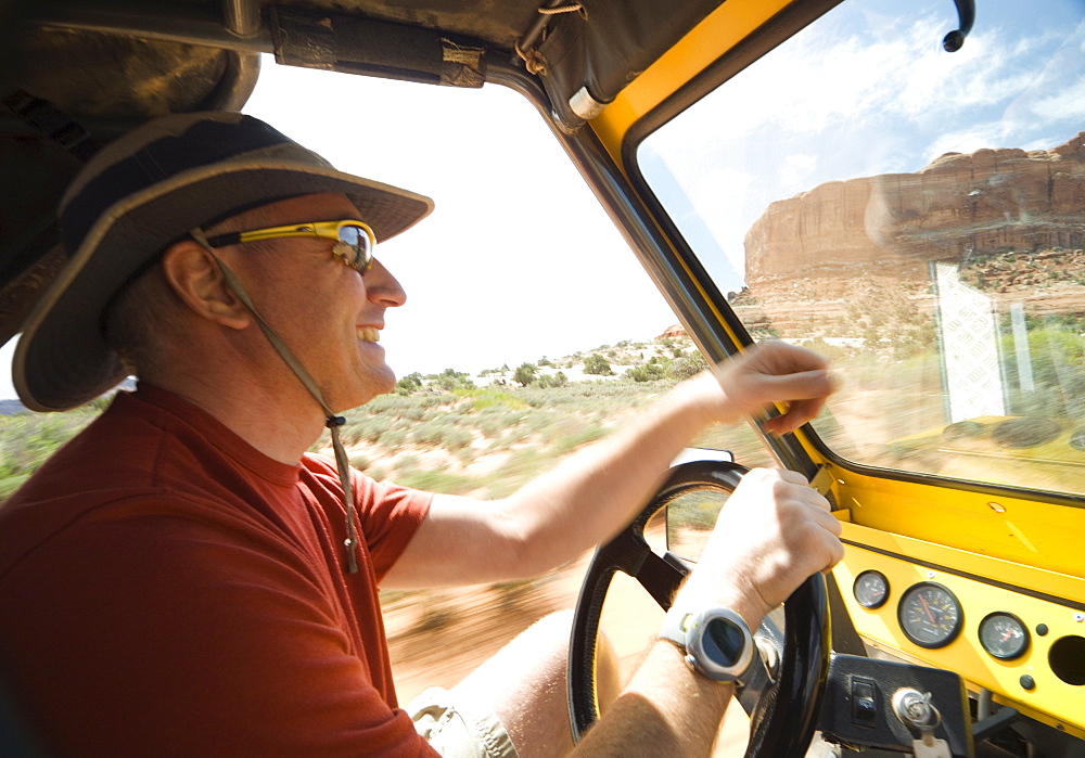 Man driving in desert