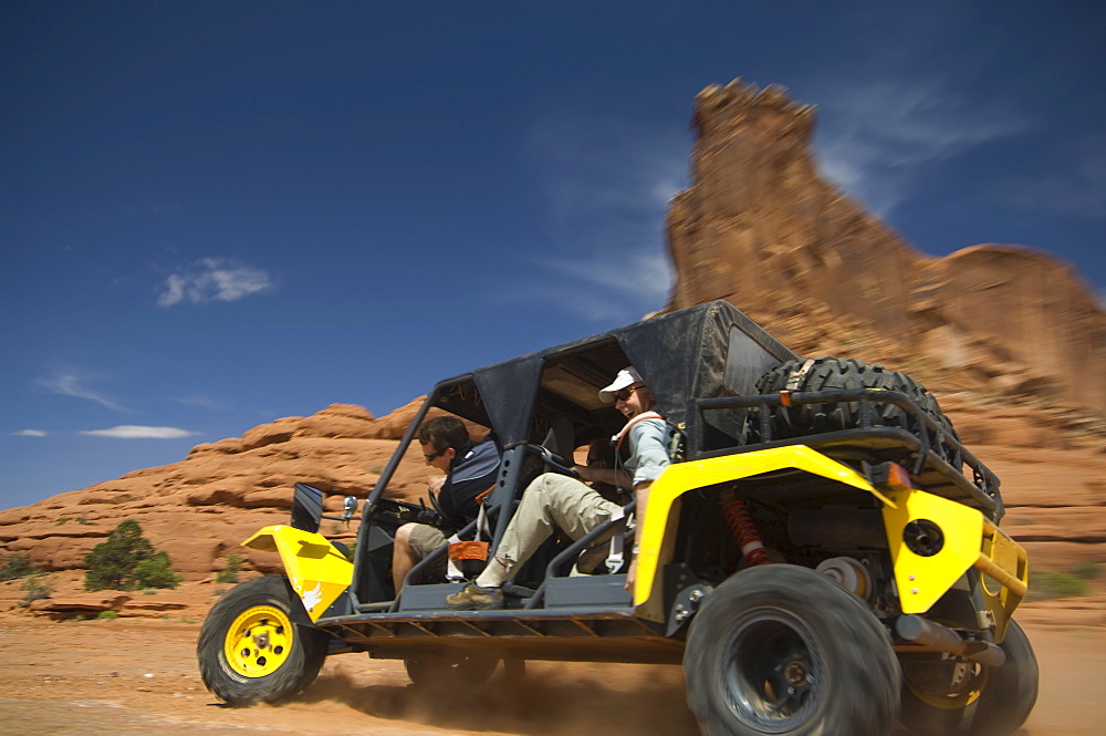 Man driving off-road vehicle in desert