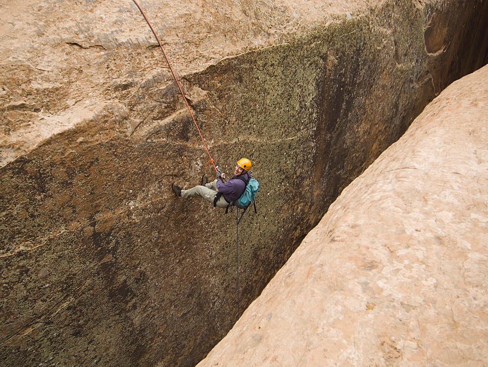 Man canyon rappelling