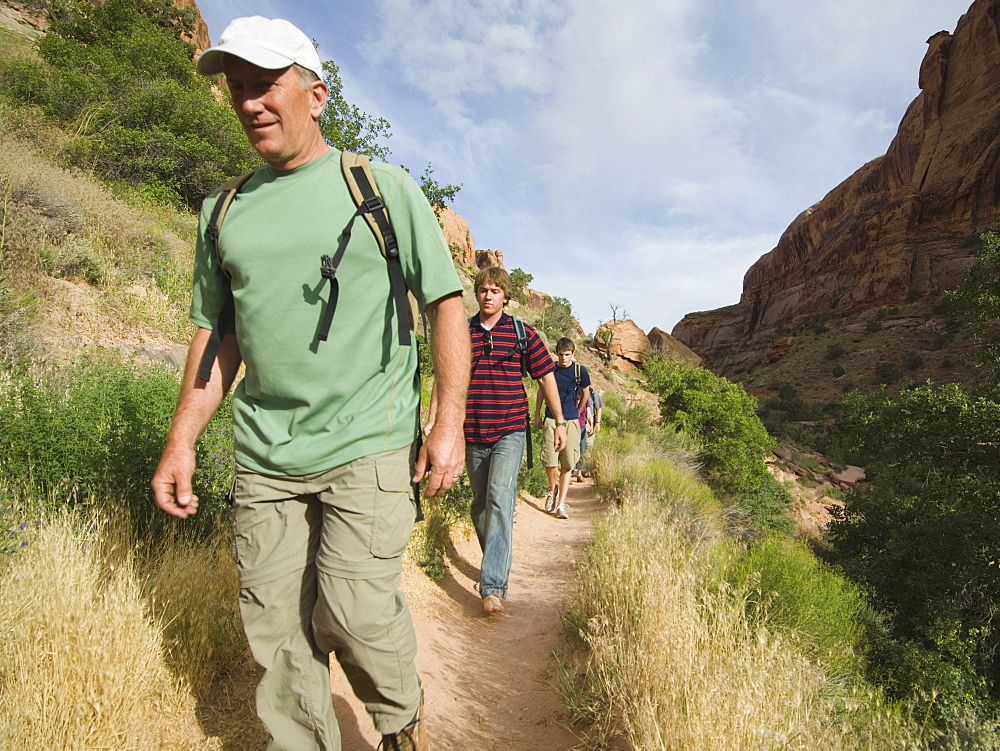 Family hiking in desert