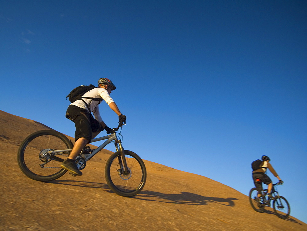 People riding mountain bikes