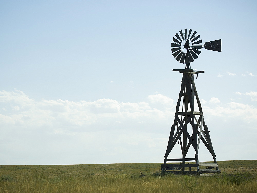 Windmill in field