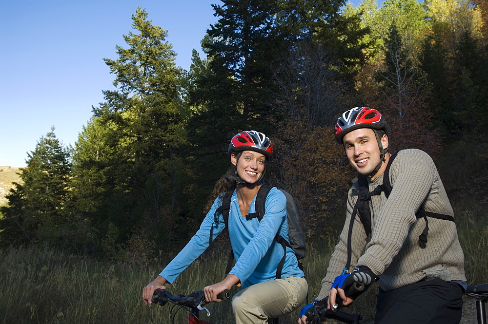 Couple on mountain bikes, Utah, United States