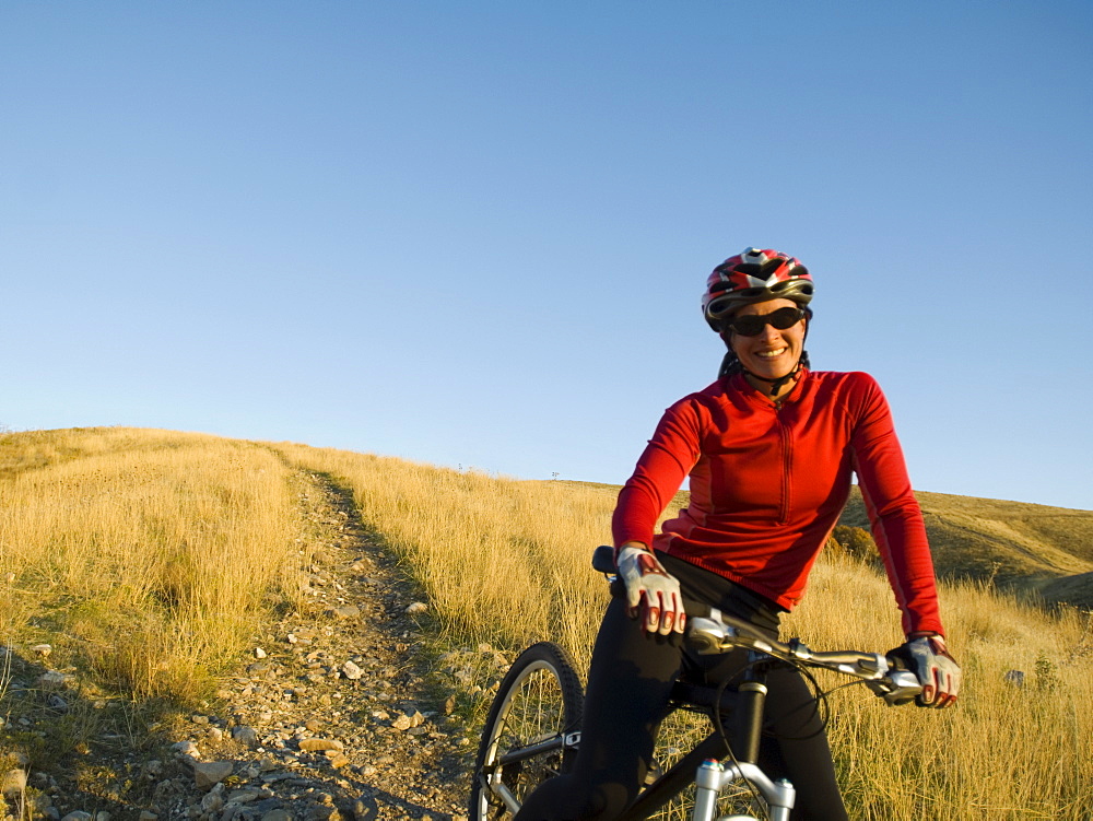 Woman on mountain bike, Salt Flats, Utah, United States