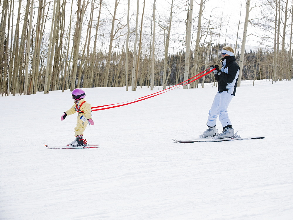 Parent and child skiing