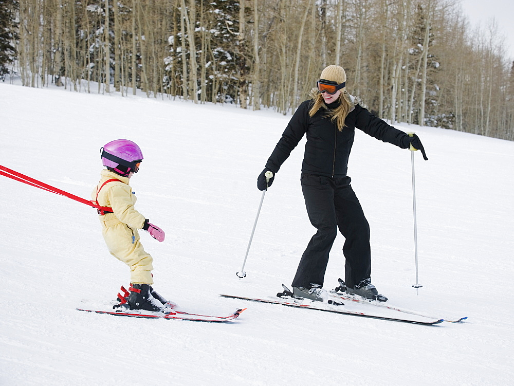 Mother and child skiing