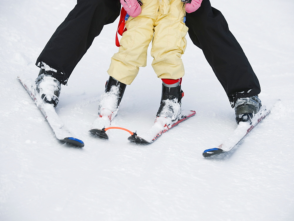 Parent and child skiing