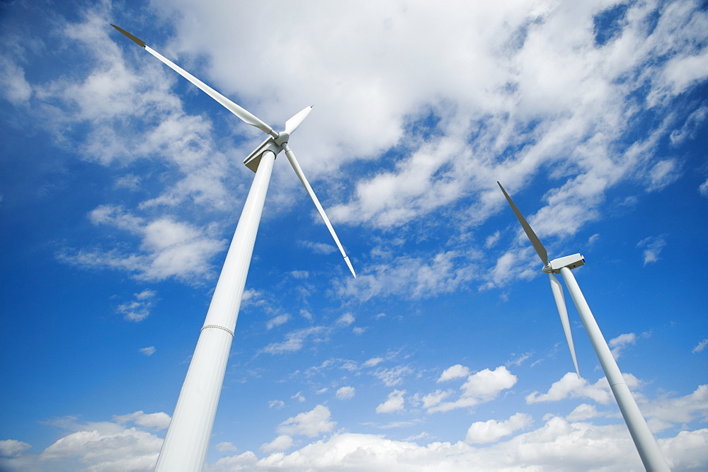 Low angle view of wind turbines