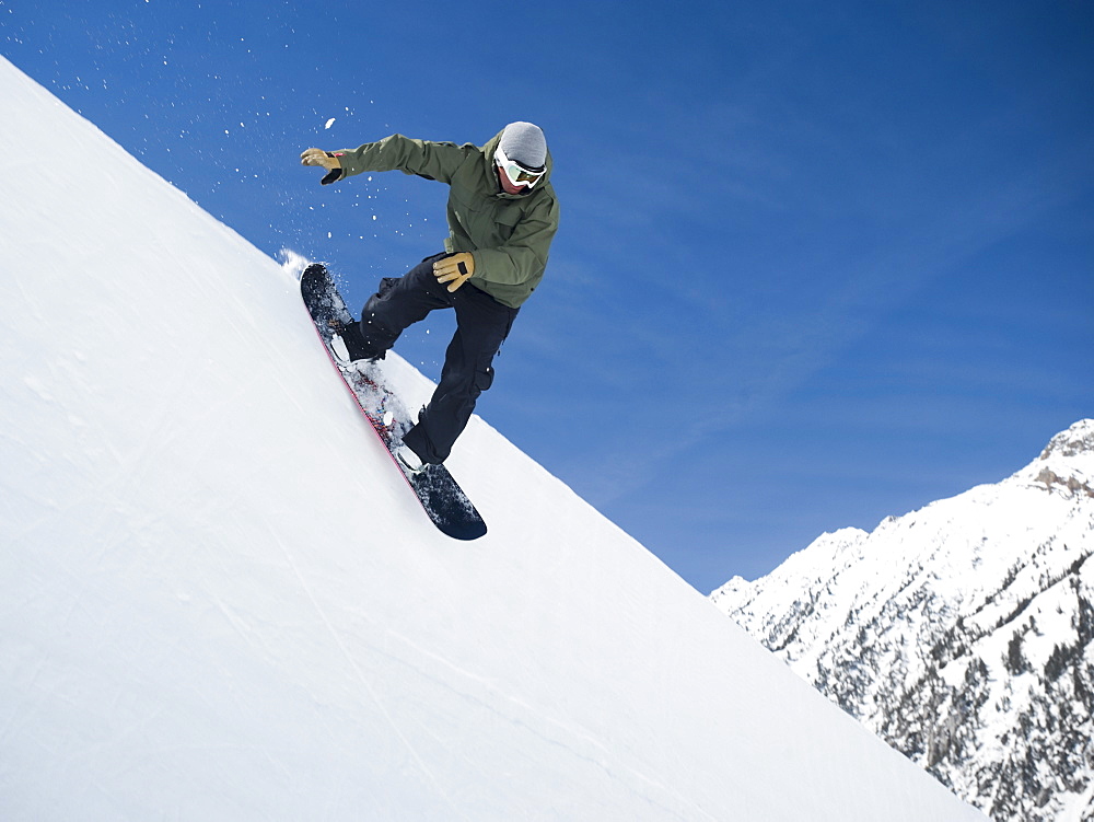 Man on snowboard in air