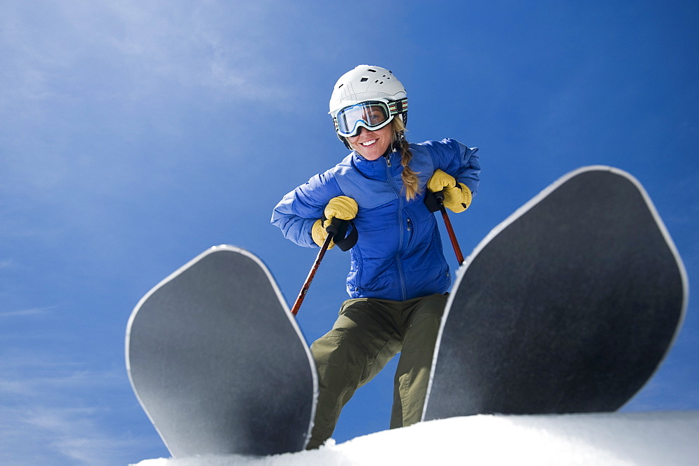 Low angle view of woman on skis