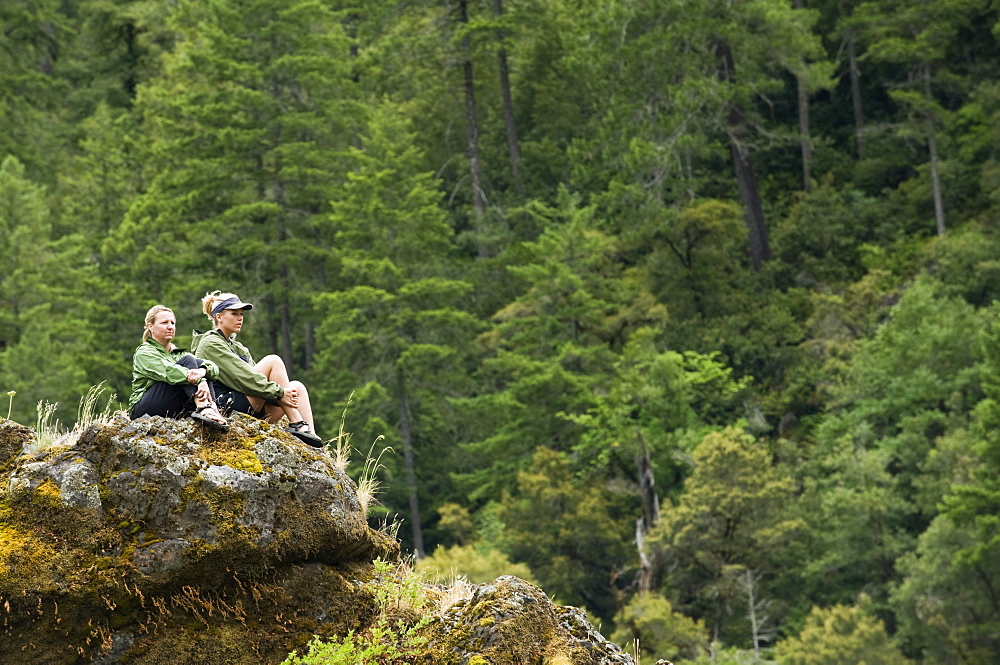 Hikers enjoying view from rock outcropping