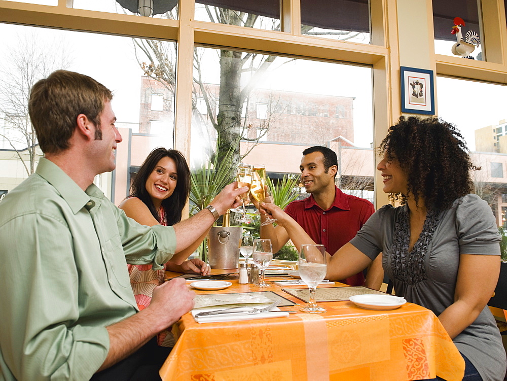 Friends toasting in restaurant