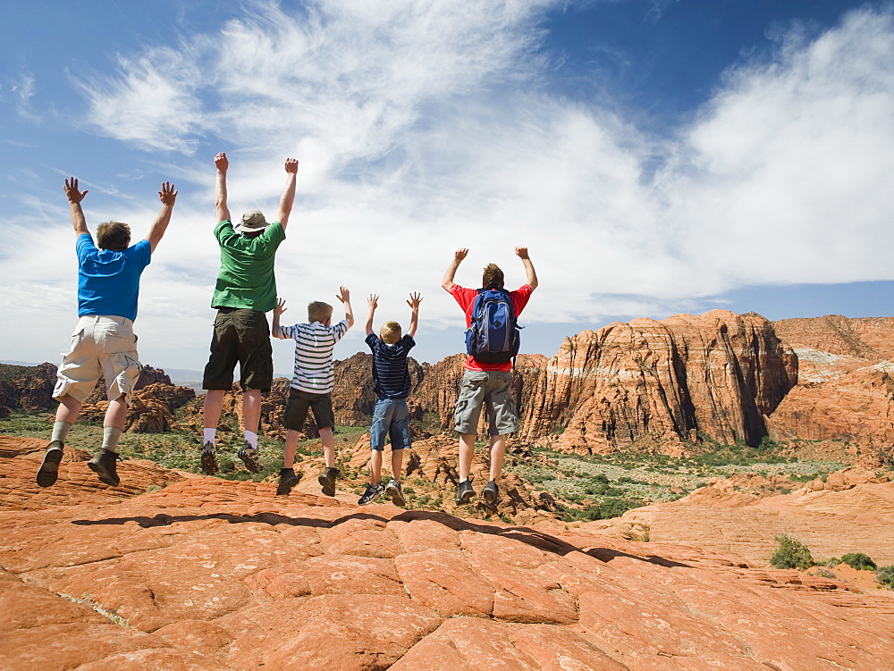 A father with kids at Red Rock jumping