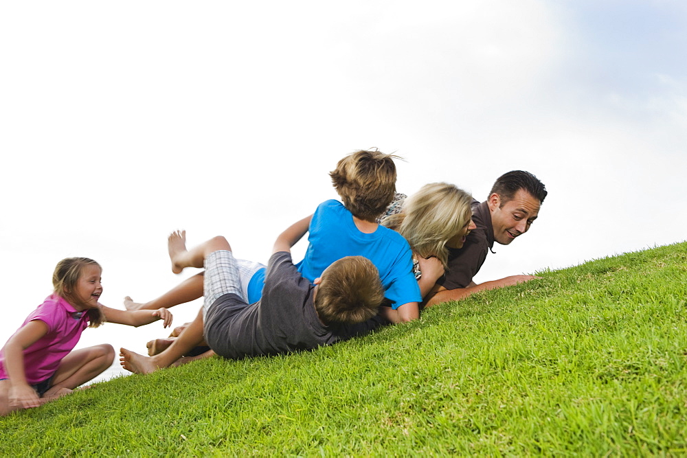 Family playing on grass