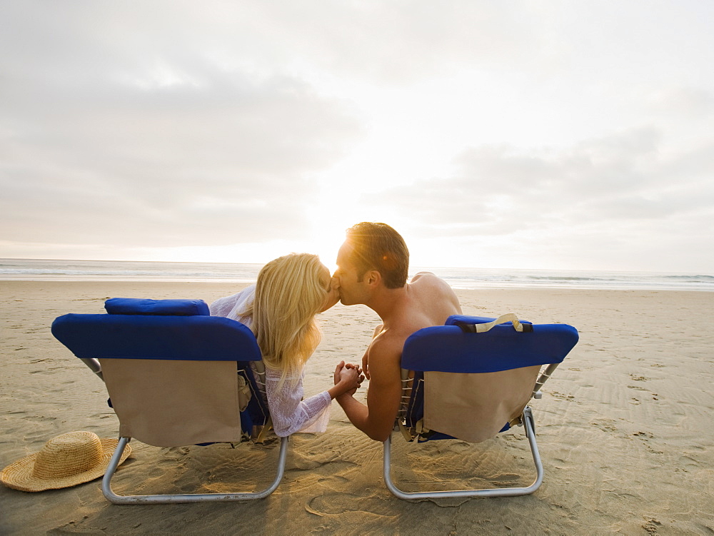 Couple kissing at the beach