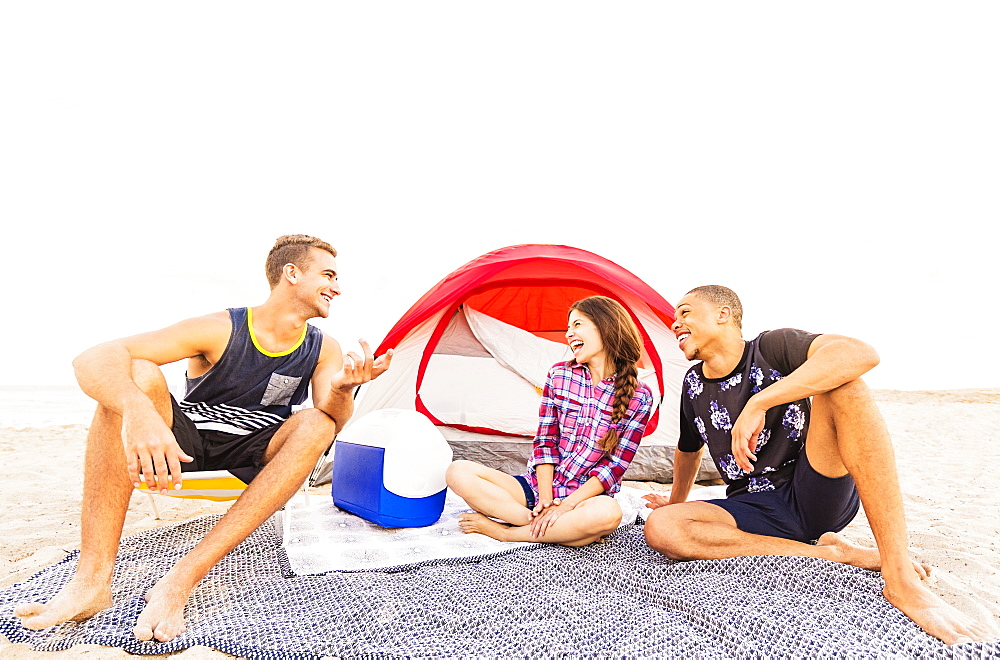 Young people relaxing on beach