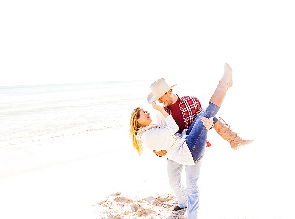 Loving couple dancing on beach, Jupiter, Florida