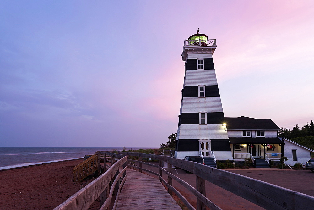 West Point Lighthouse and sandy beach at dusk, Prince Edward Island, New Brunswick, Canada