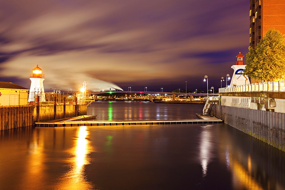 Illuminated Saint John Coast Guard Base Lighthouse seen from harbor, New Brunswick, Canada