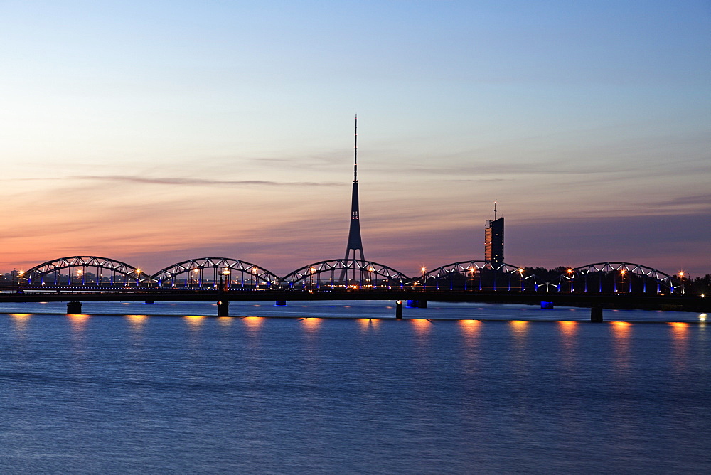 Arch bridge and Riga Radio and TV Tower at sunrise, Latvia