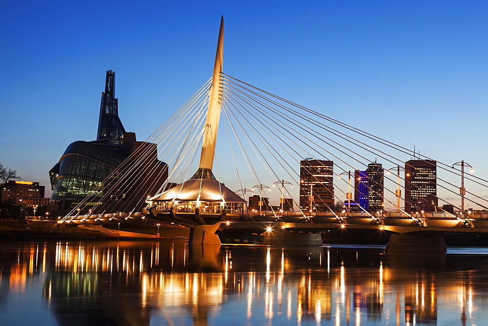 Canadian Museum for Human Rights and Esplanade Riel bridge at dusk, Winnipeg Manitoba, Canada