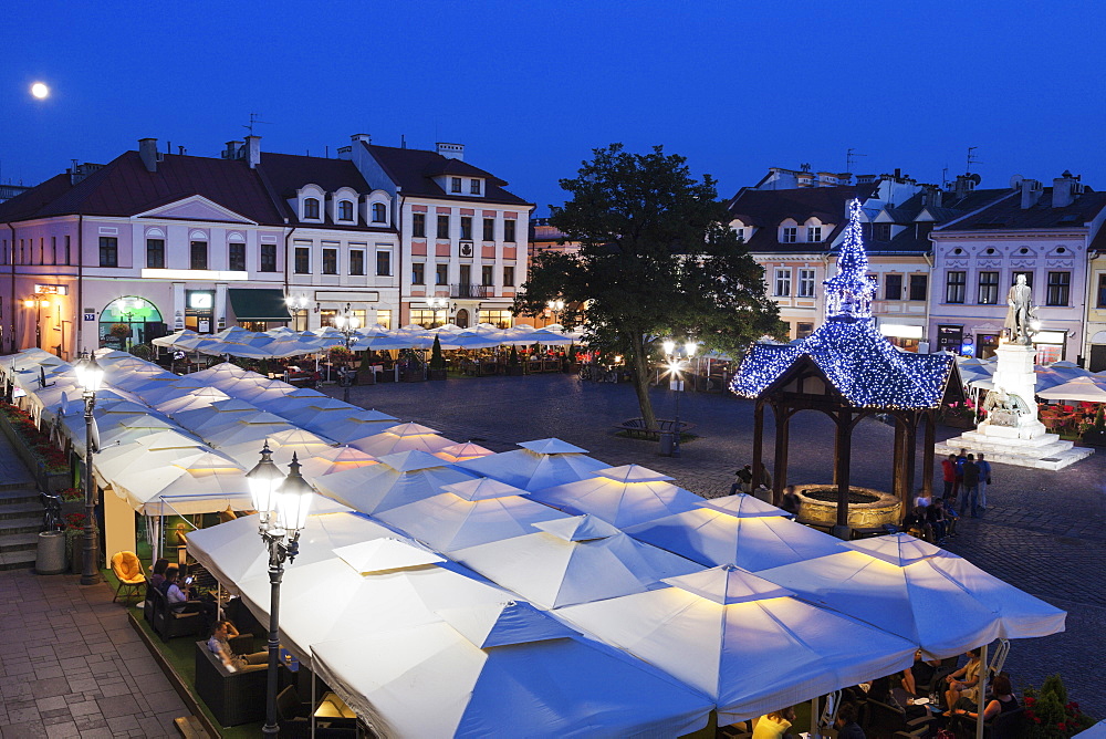 High angle view of market square at night, Poland