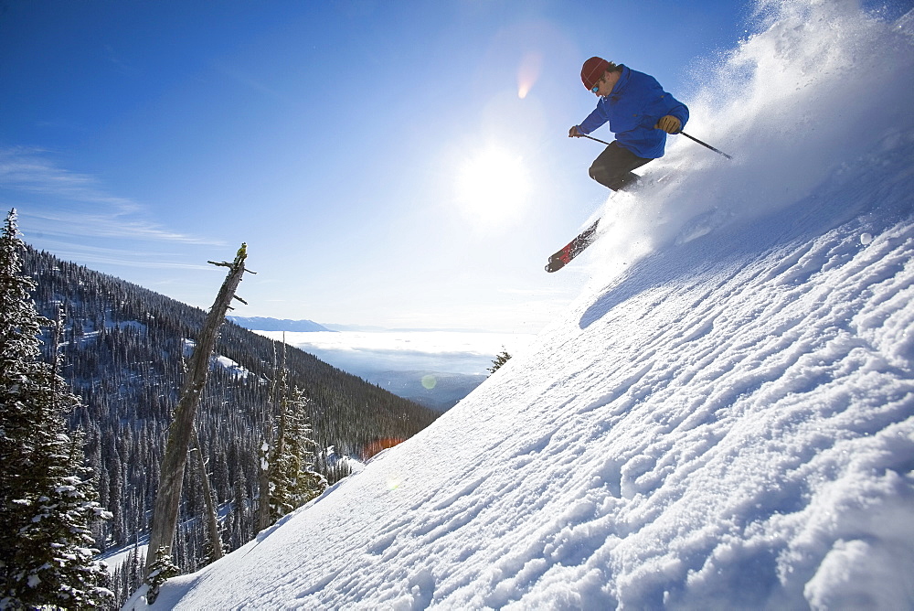 Man skiing in mountains, Whitefish,Montana,USA