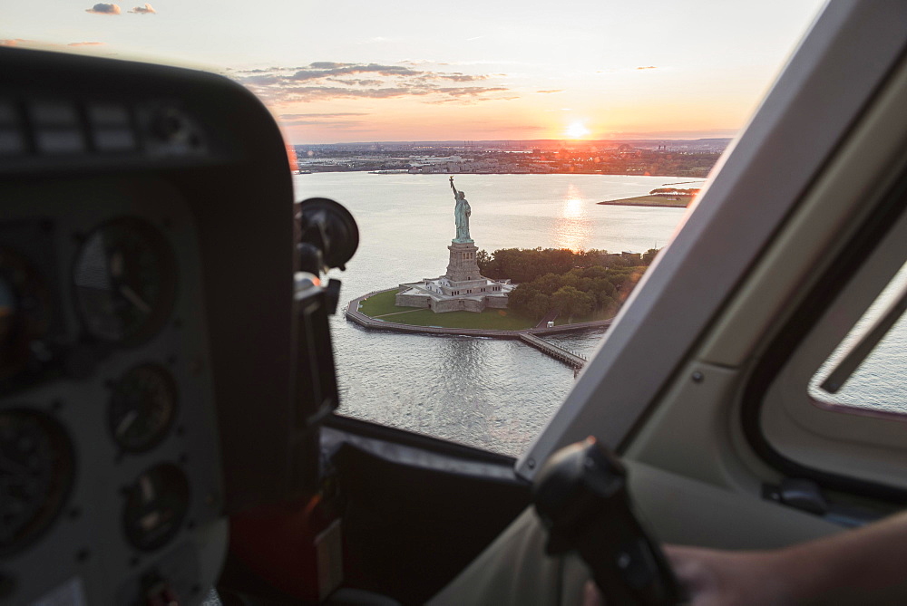 Cockpit in helicopter and Statue of Liberty, New York, New York