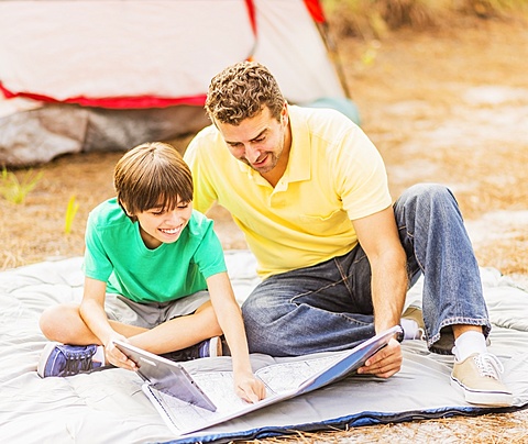 Father and son (12-13) camping, Jupiter, Florida