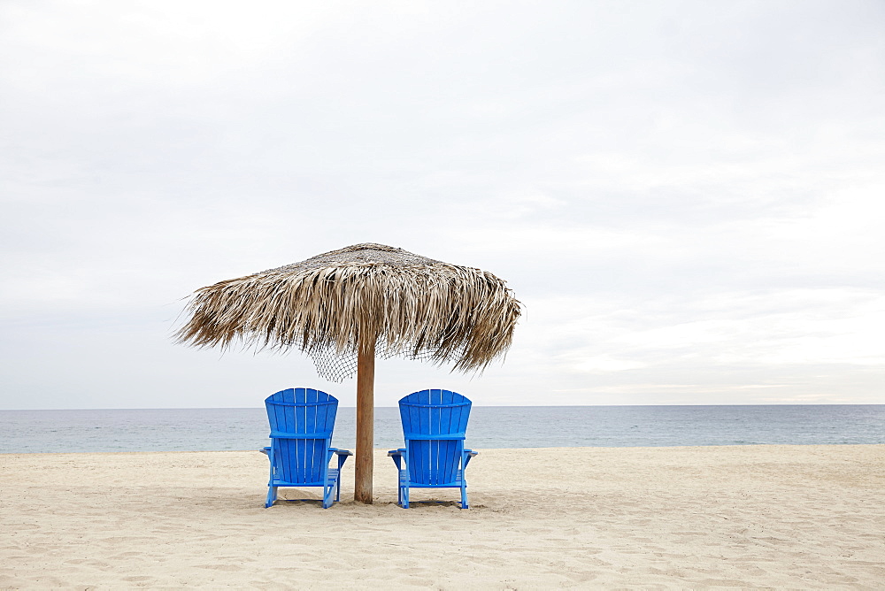 View of deckchairs on beach, Cabo San Lucas, Mexico