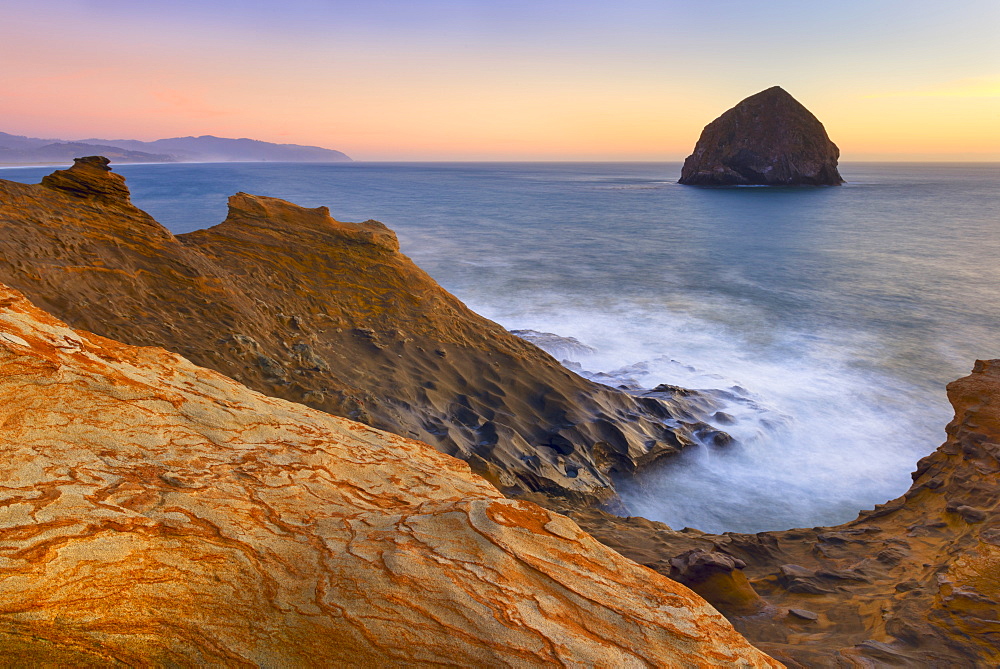 Scenic view of rock formations along coastline, Cape Kiwanda, Oregon