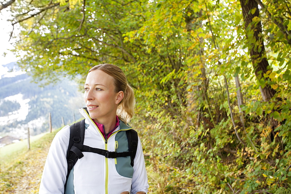 Woman hiking in mountains, Austria, Salzburger Land, Maria Alm