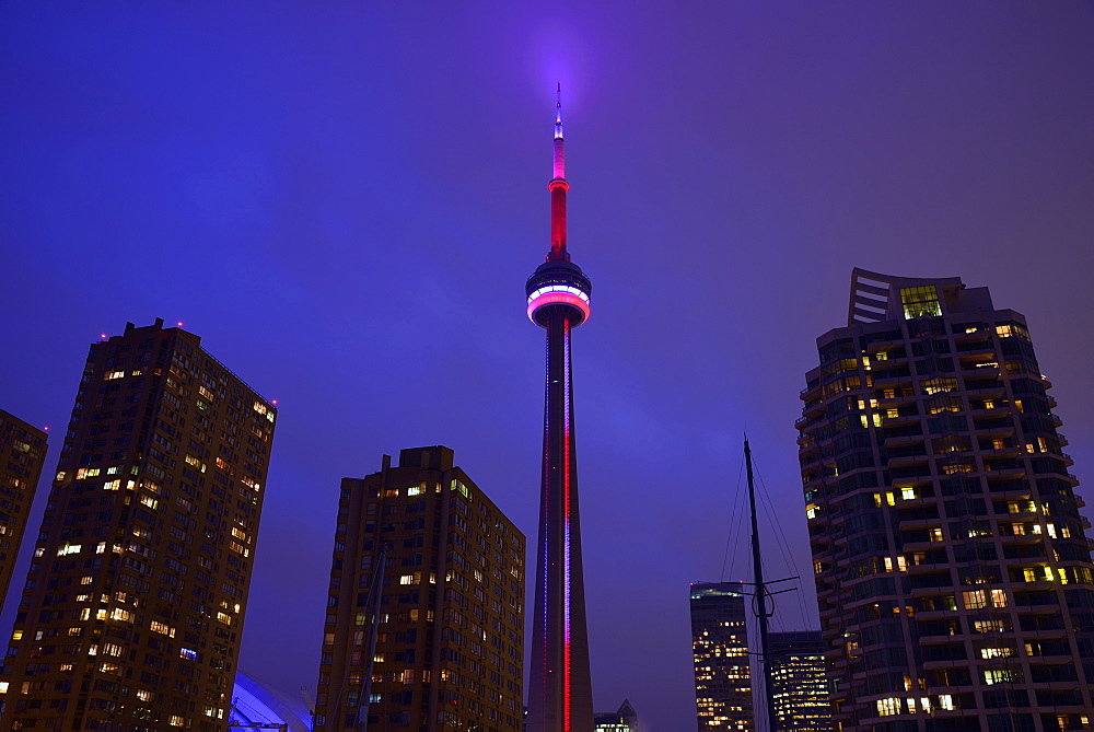 Illuminated city at dusk and CN Tower, Toronto, Canada