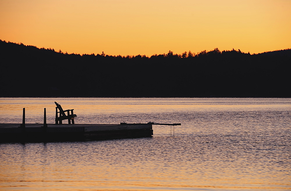 Jetty on lake at dawn, Lake George, New York