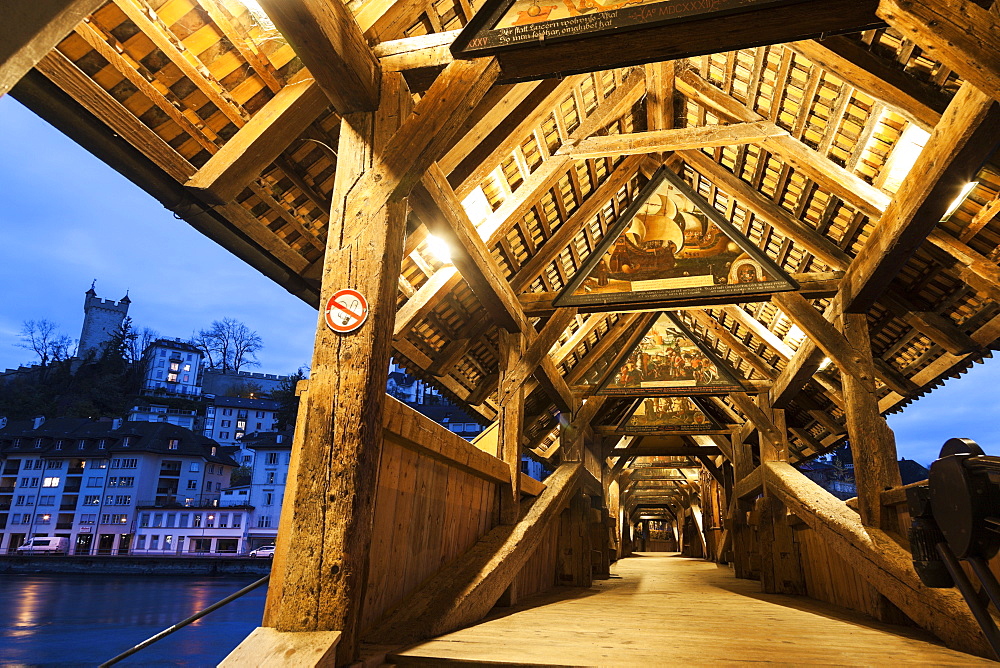 View along illuminated Spreuer Bridge, Spreuer Bridge (Spreuerbrucke) and city wall tower, Lucerne, Switzerland