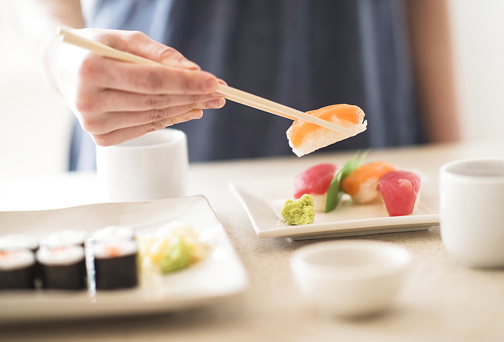 Close-up of woman preparing sushi