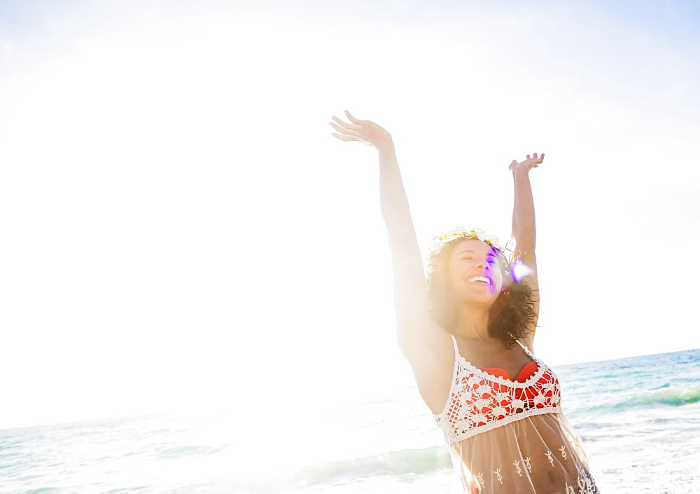 Young woman smiling on beach, USA, Florida, Jupiter